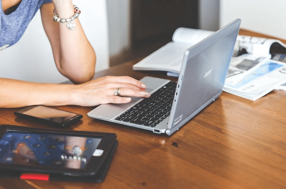 Woman typing on her laptop
