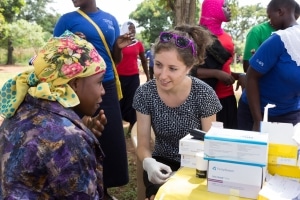 Volunteer medical staff assisting a woman