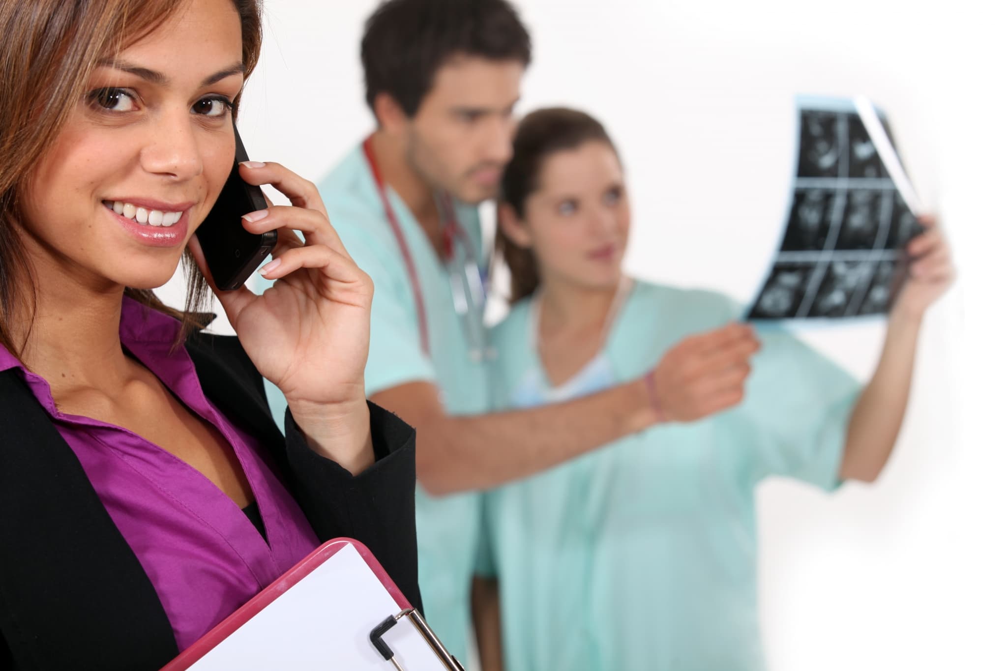 Hospital manager with team in the background