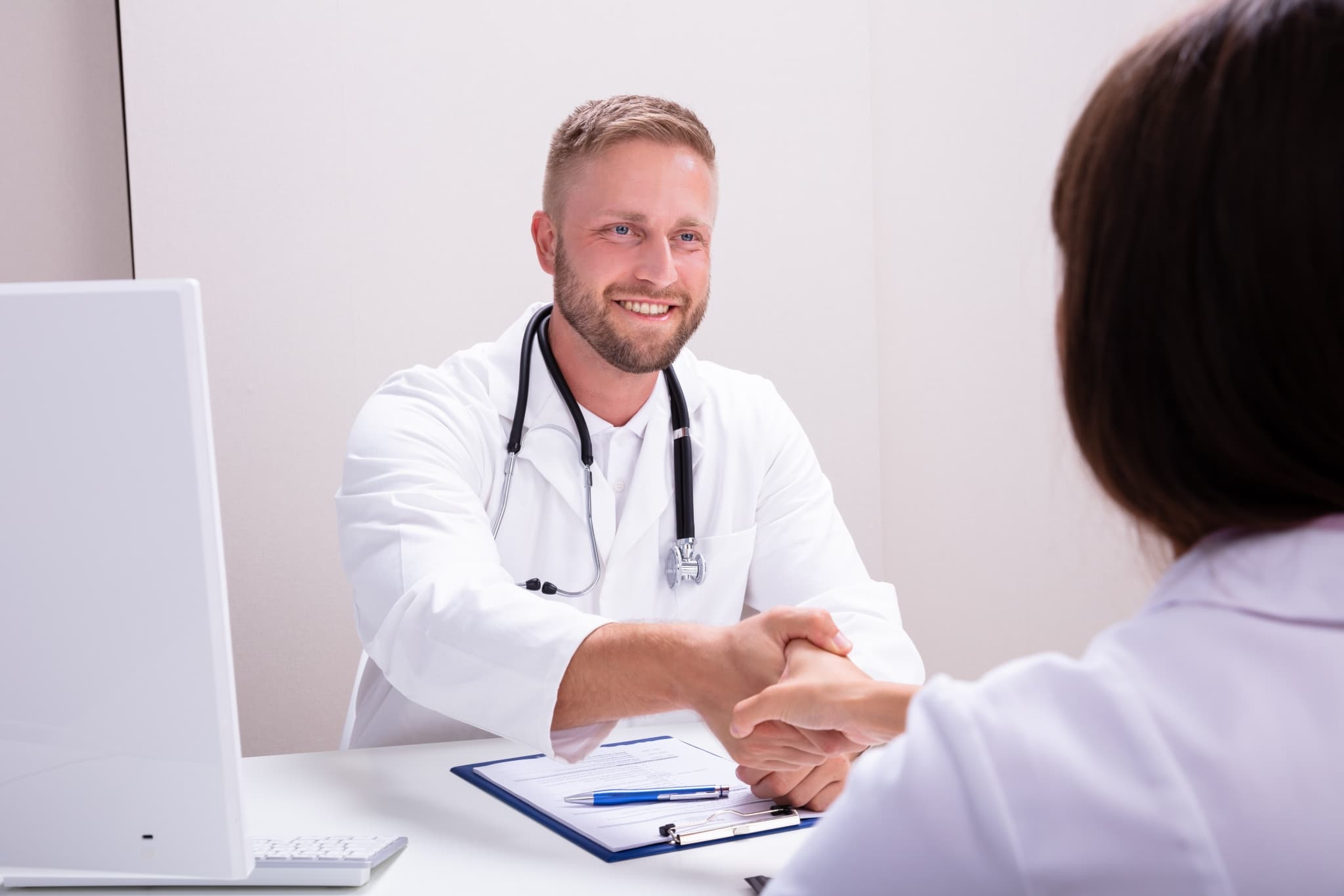 Medical professionals shaking hands