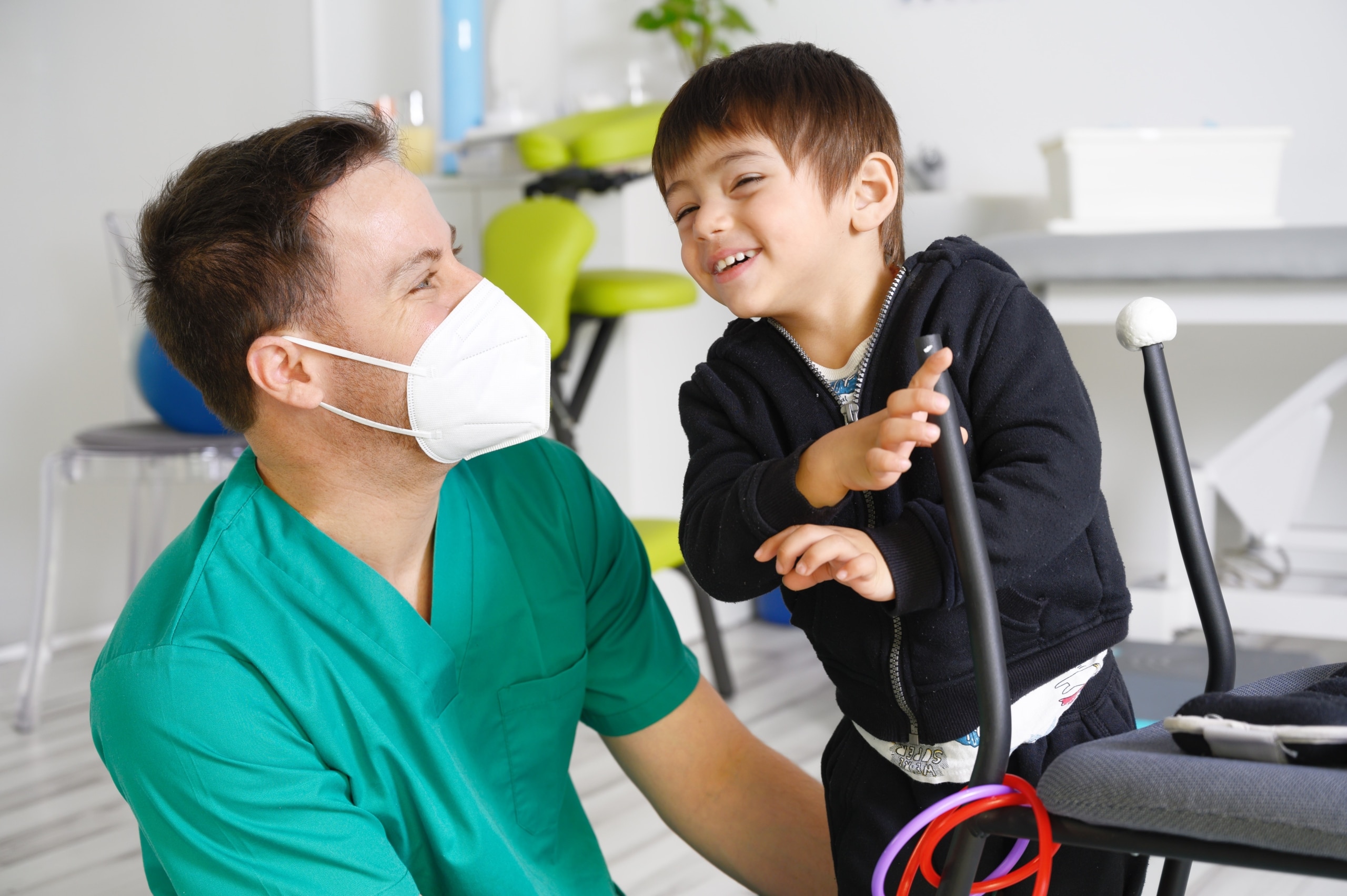 Child with cerebral palsy and medical worker